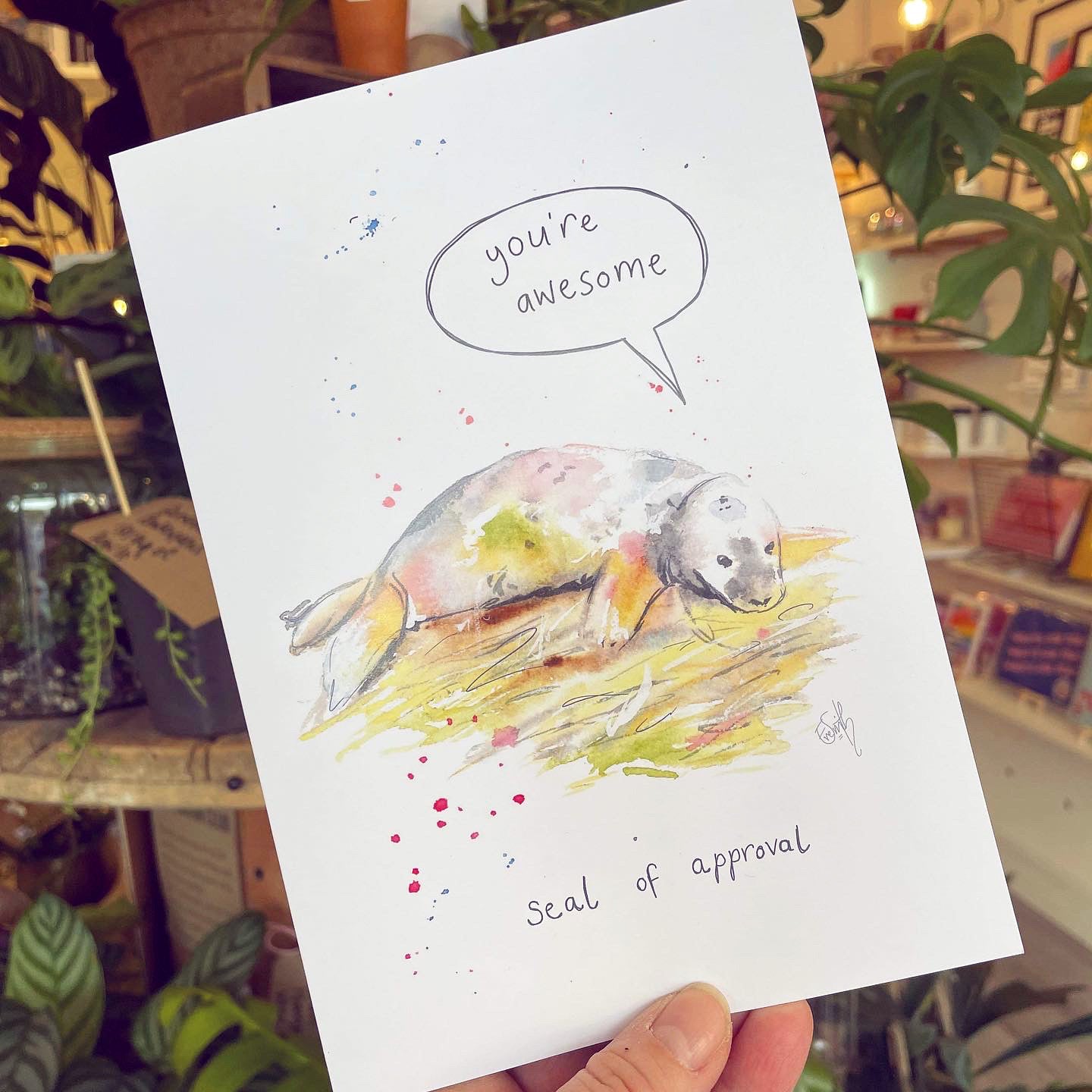 A greetings card featuring original watercolour artowork of a seal at Donna Nook by Eve Leoni Art.