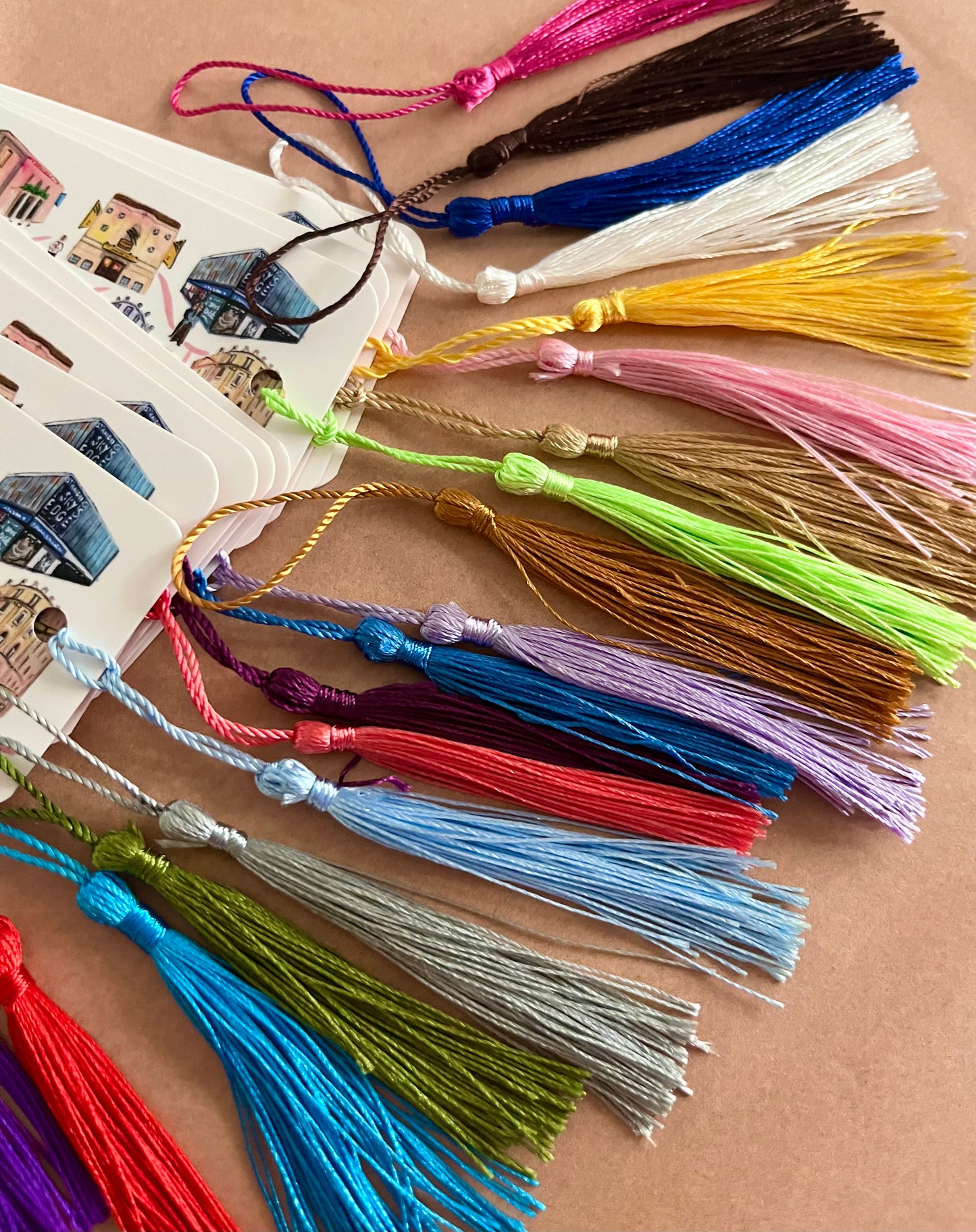 An array of different coloured bookmark tassles by Eve Leoni Art.