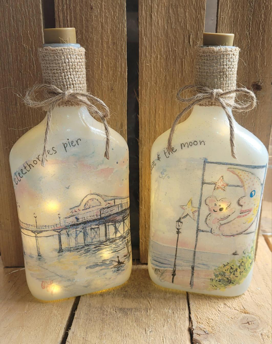 Decoupaged jars lit up with fairylights, hand decorated by Eve Leoni Art and Jollypotz.