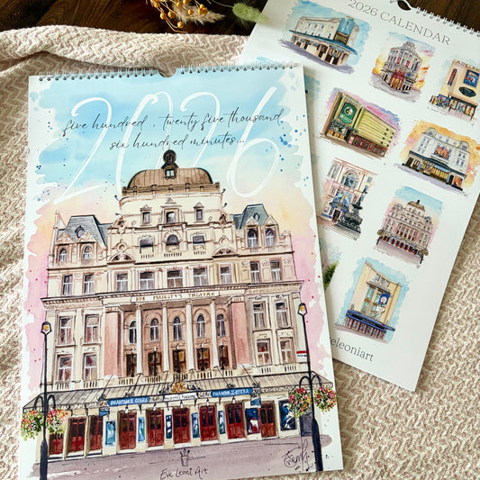 2026 West End Theatre calendar with a watercolour illustration of His Majesty's Theatre by Eve Leoni Art on textured surface