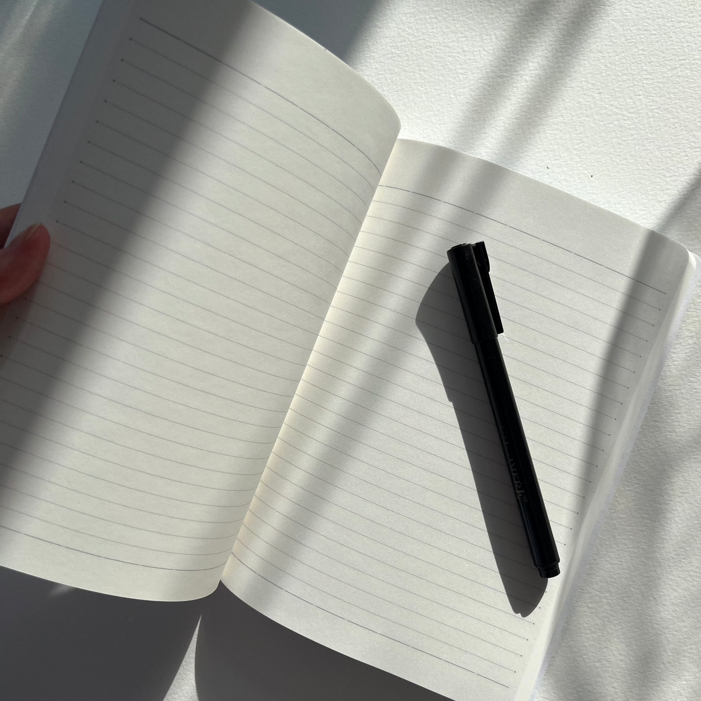 The inside of a luxury lined notebook featuring watercolour artwork by Eve Leoni Art.