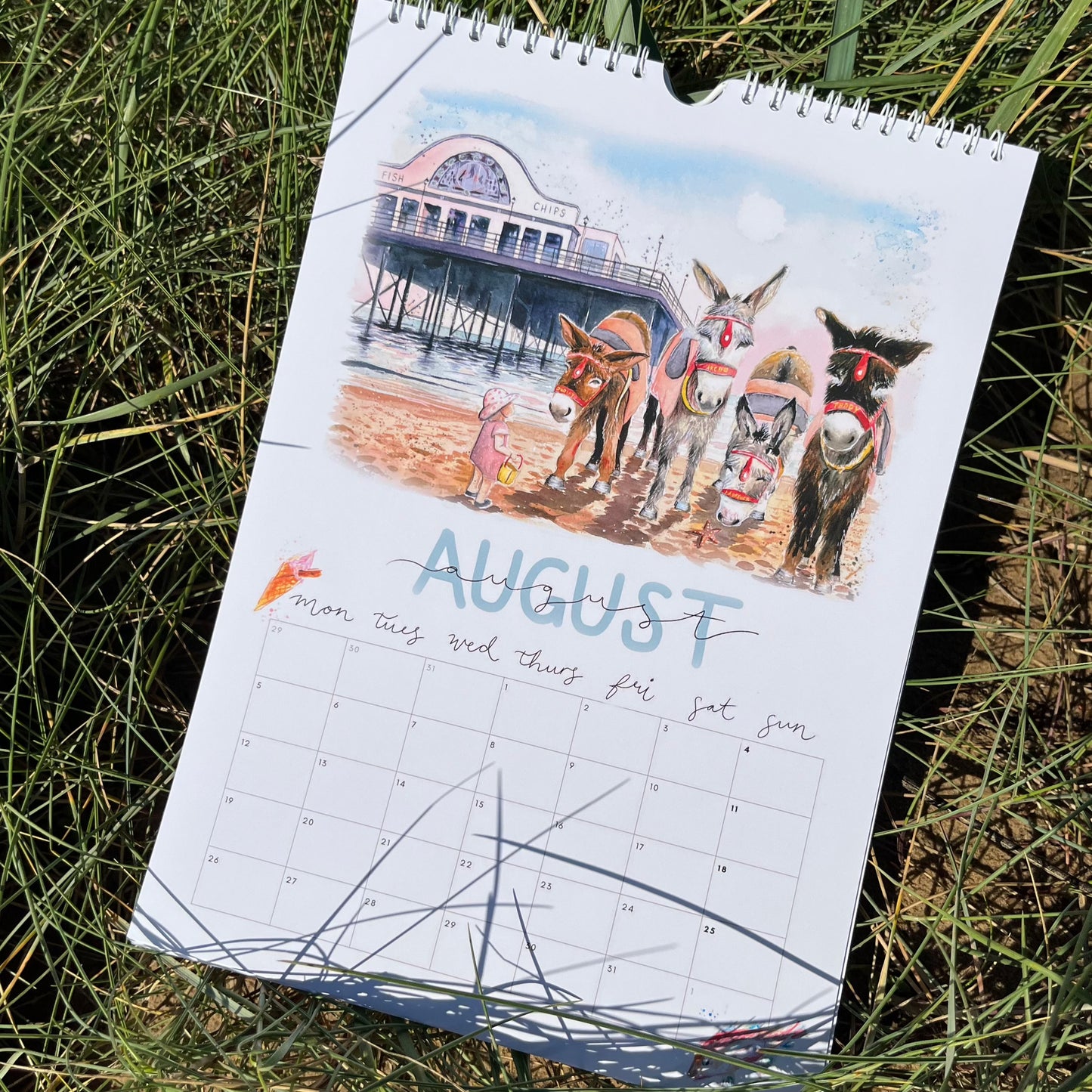 A Cleethorpes calendar for 2024 featuring the donkeys in front of Cleethorpes pier, by local artist, Eve Leoni Smith.