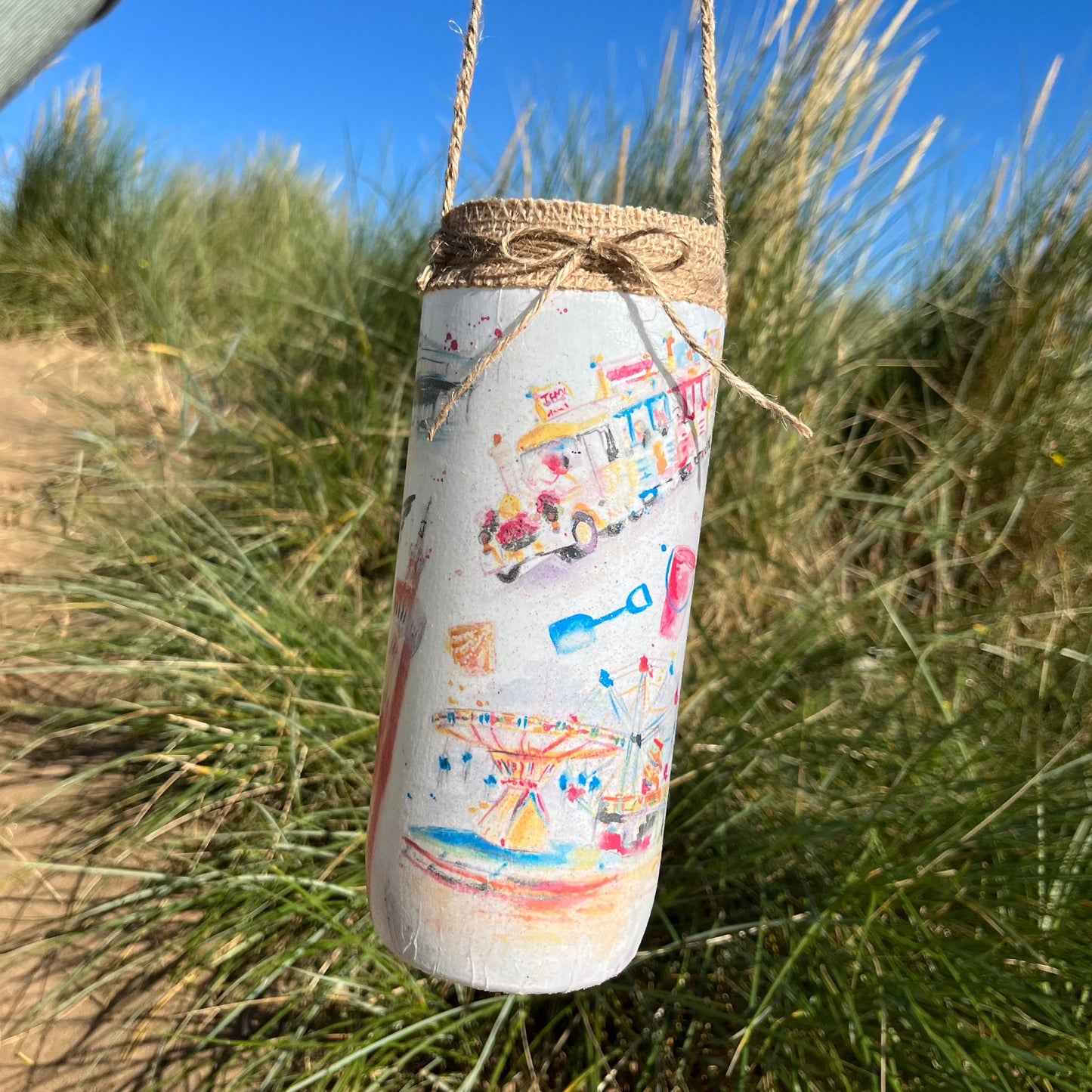 A decoupaged jar featuring watercolour illustrations of local landmarks in Grimsby and Cleethorpes by local artist, Eve Leoni Smith and Jollpotz.