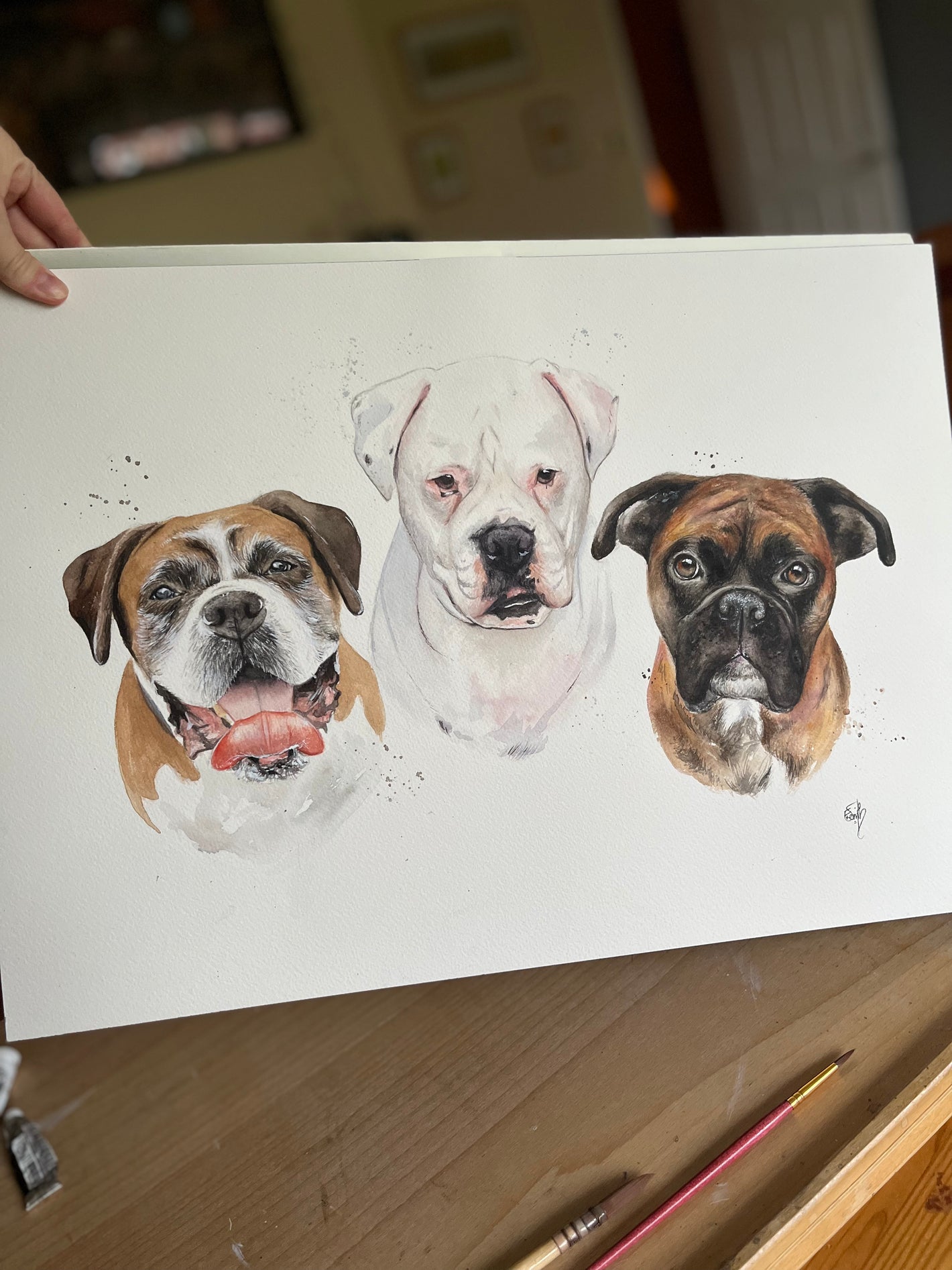 An eye-catching watercolour pet portrait of three different dogs, painted by local Cleethorpes artist, Eve Leoni Art.
