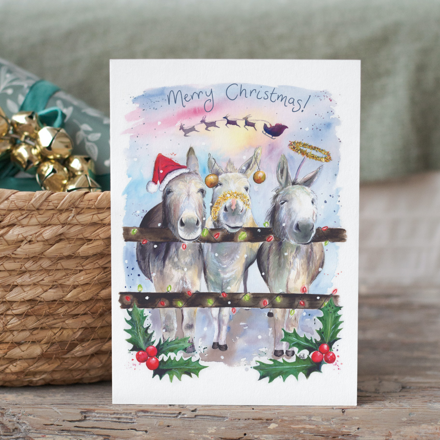 A commissioned watercolour painting of three donkeys celebrating Christmas in Cleethorpes. Painted by local watercolour artist, Eve Leoni Smith.