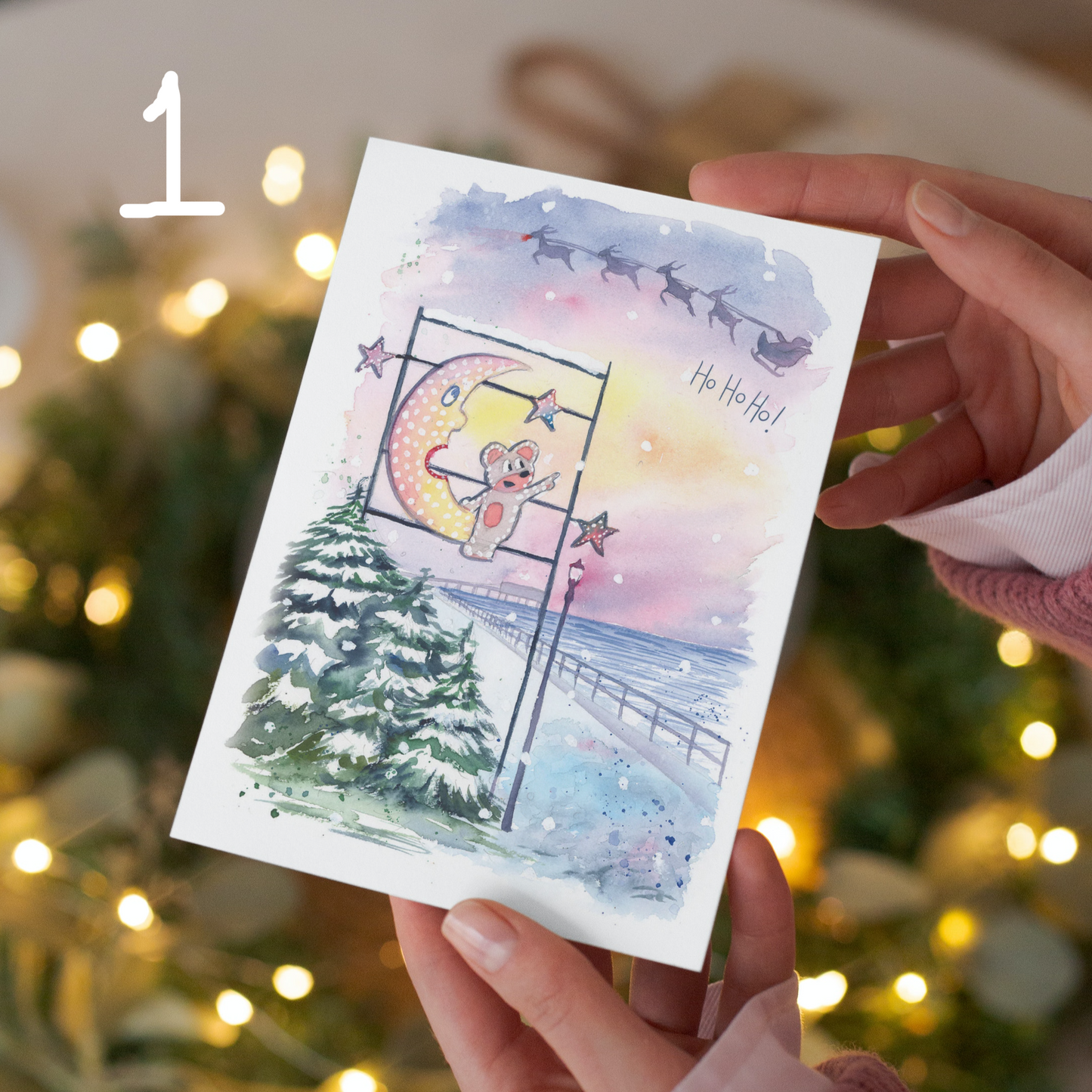 A watercolour painting of the Mouse and the Moon watching Santa and his reindeers fly over the Cleethorpes Pier on the seafront. Painted by local watercolour artist, Eve Leoni Smith.
