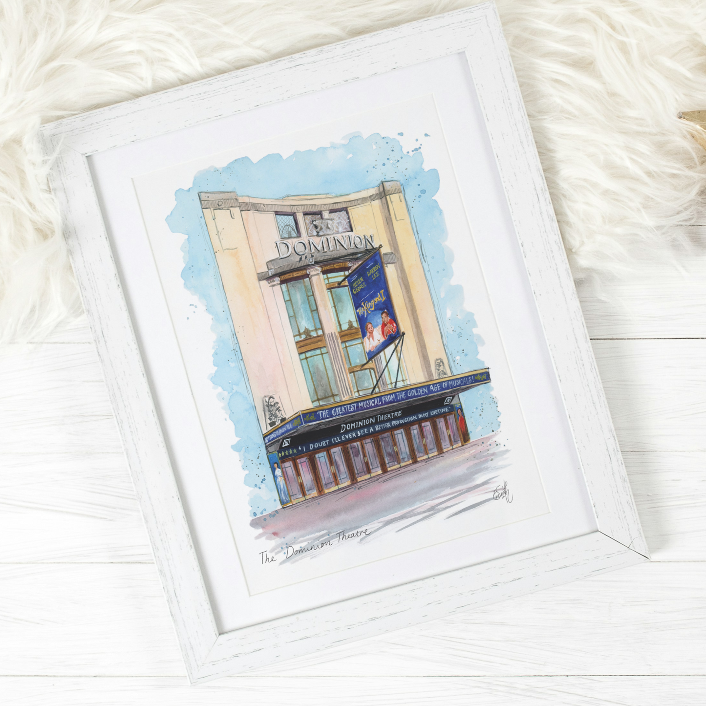 An original watercolour painting of the Dominion Theatre in the West End, showing the classic musical, The King and I. Painted by Eve Leoni Art, this musical theatre print is the perfect gift for any musical lover.