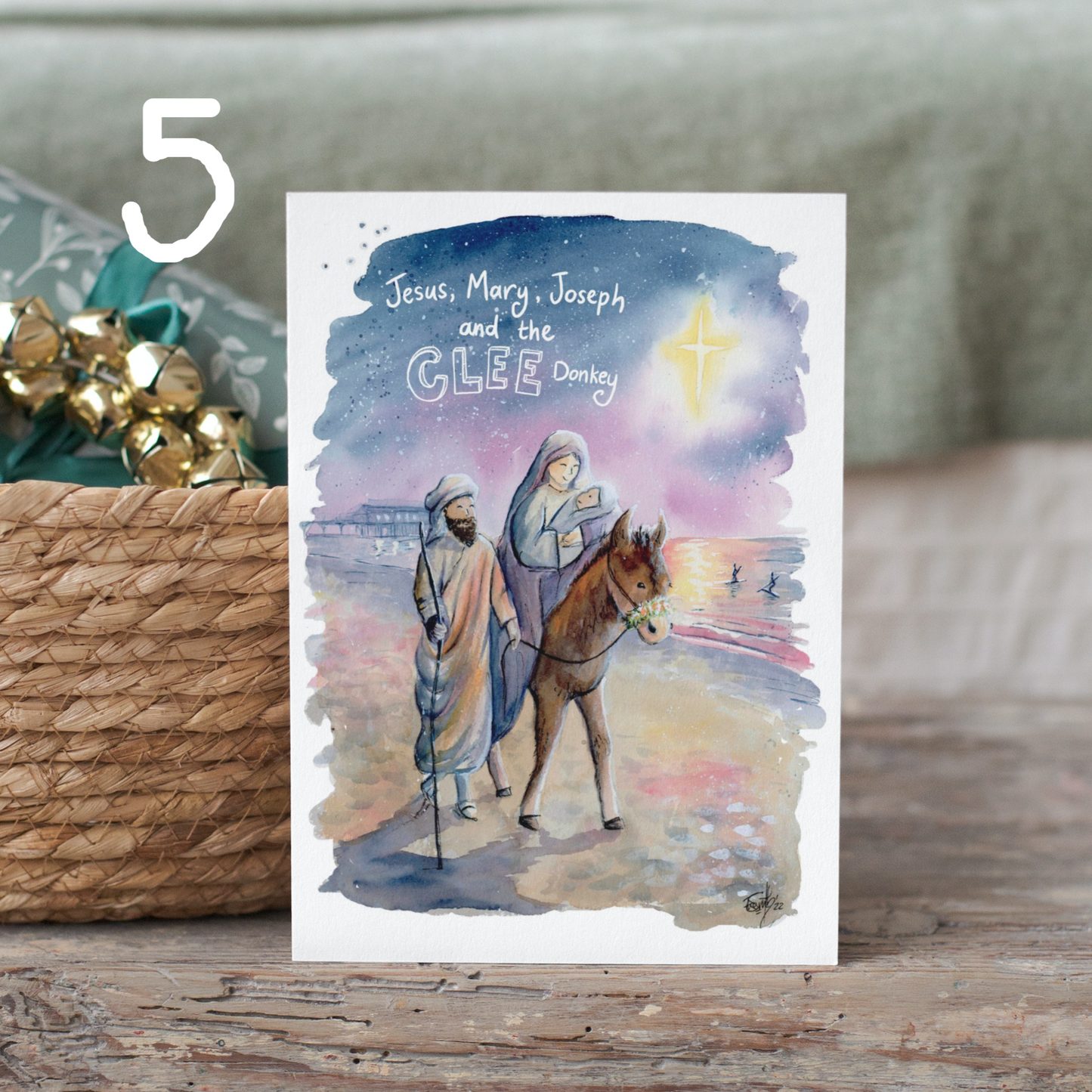 A watercolour Christmas card featuring a nativity scene on cleethorpes beach by Grimsby artist, Eve Leoni.