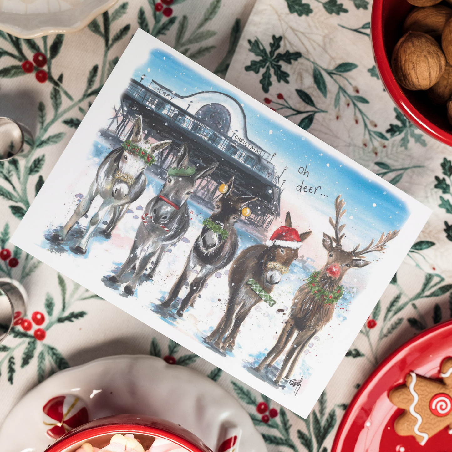A local Christmas card featuring Eve Leoni's bestselling Christmas watercolour painting of the donkeys on Cleethorpes beach with Rudolph in front of the Cleethorpes Pier.