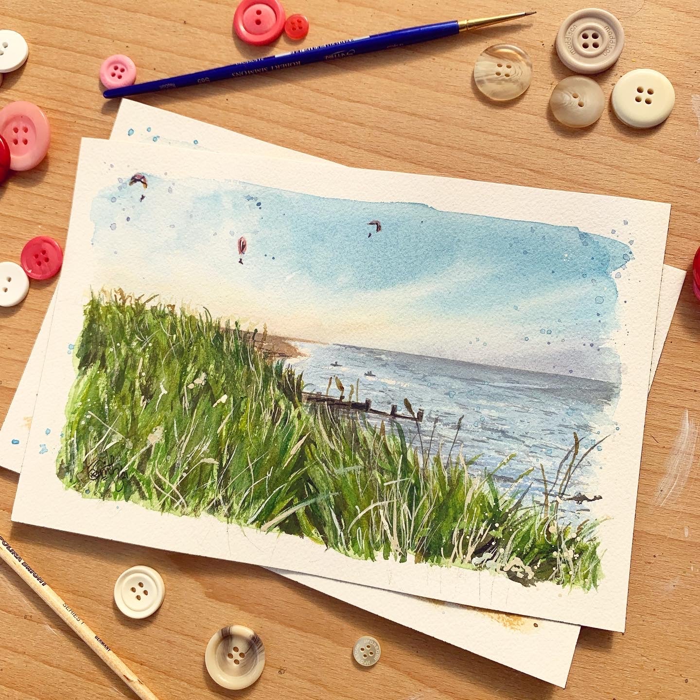 An original watercolour painting of the paragliders above the beach at Humberston Fitties. Painted by local watercolour artist, Eve Leoni Smith. 