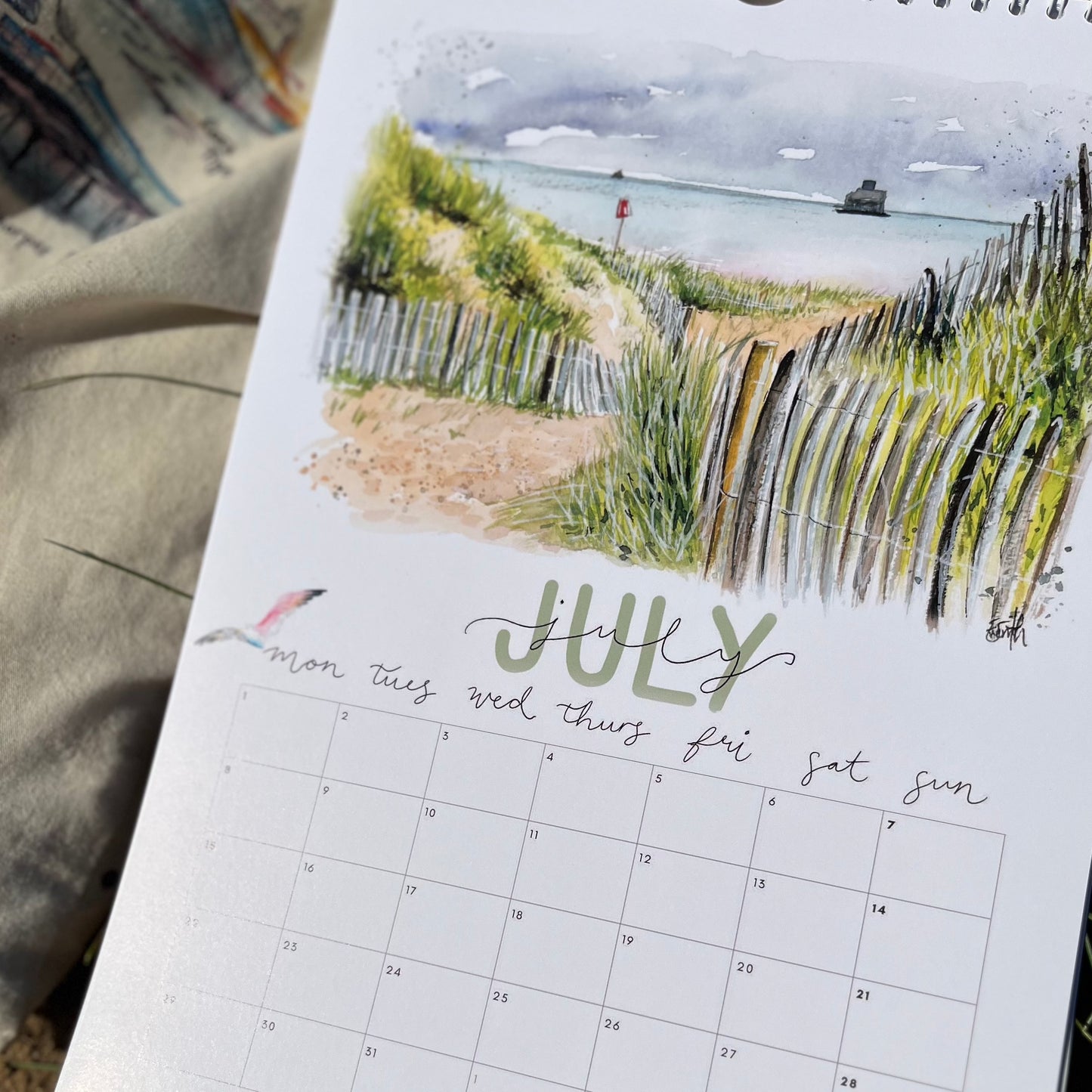 2024 calendar featuring watercolour artwork of Humberston Fitties beach by Eve Leoni Art.