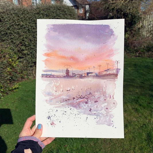 An original watercolour painting of the North promenade in Cleethorpes, featuring the pier in the distance, painted by Eve Leoni Smith.