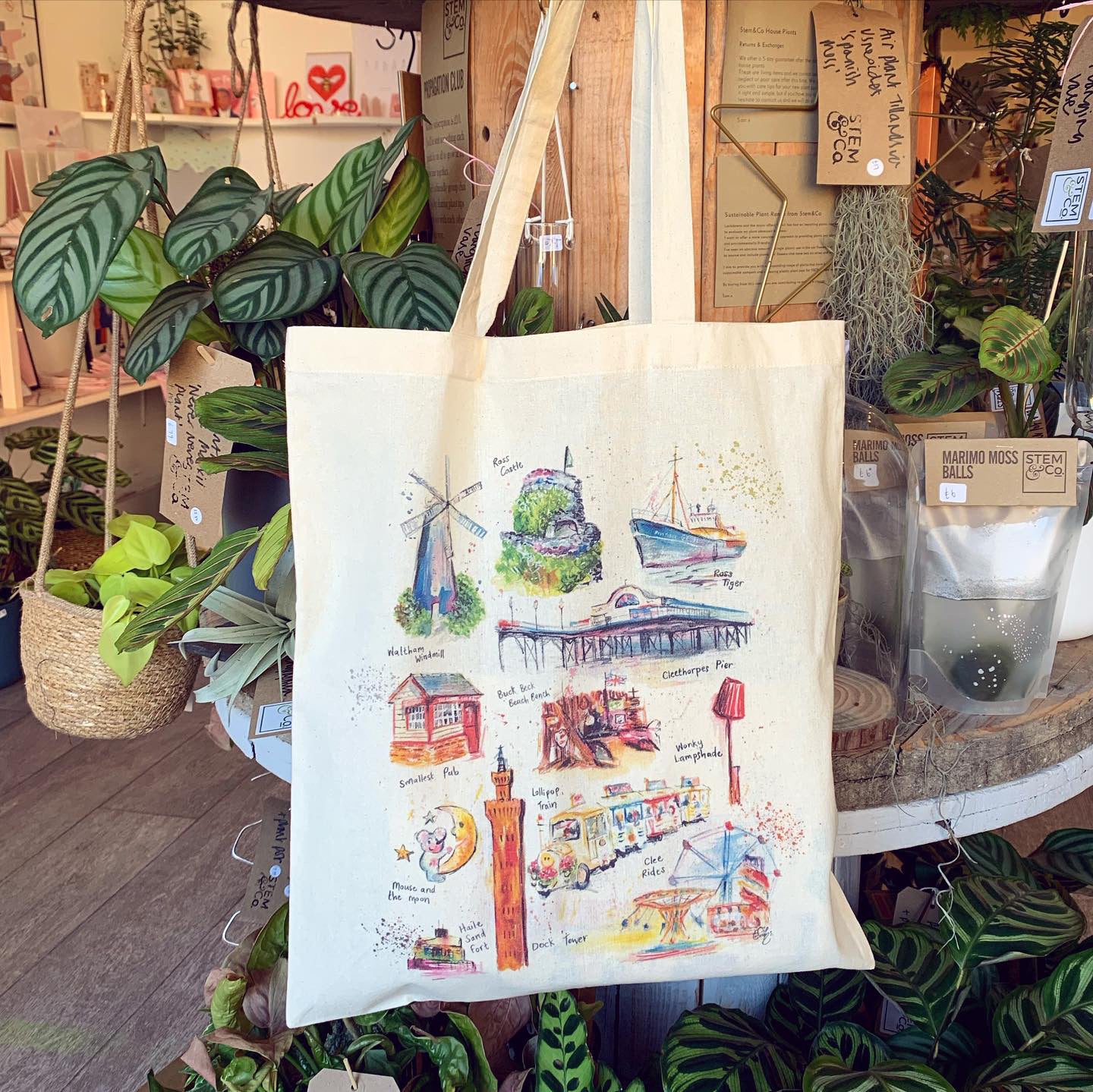Organic tote bag featuring watercolour illustrations of landmarks in Grimsby and Cleethorpes, designed by local artist, Eve Leoni Smith.