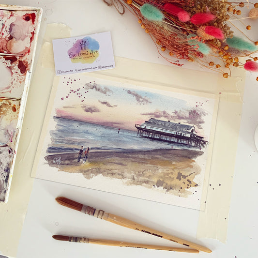 A miniature original painting of the Cleethorpes Pier at sunset in summer, painted in watercolours by local Grimsby artist, Eve Leoni Smith. 