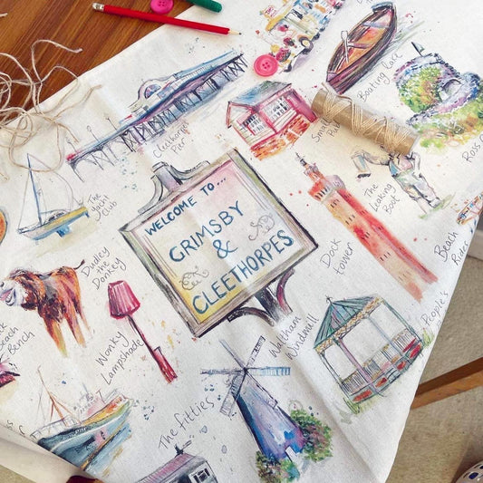 Organic tea towel as part of the luxury homeware range, featuring watercolour illustrations of local landmarks in Grimsby and Cleethorpes by local artist, Eve Leoni Smith. 