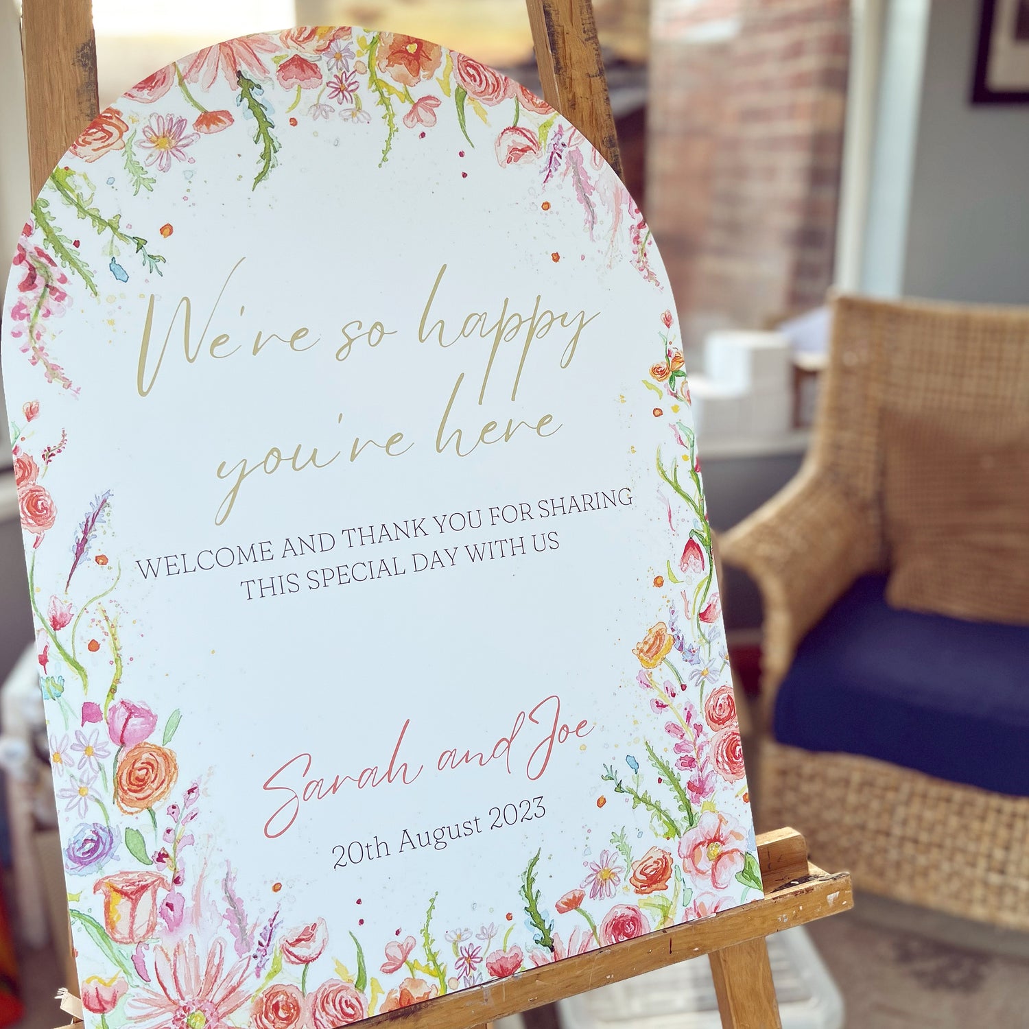 A luxury welcome board for a summer wedding, designed in watercolour paints by local artist and stationer, Eve Leoni Smith.
