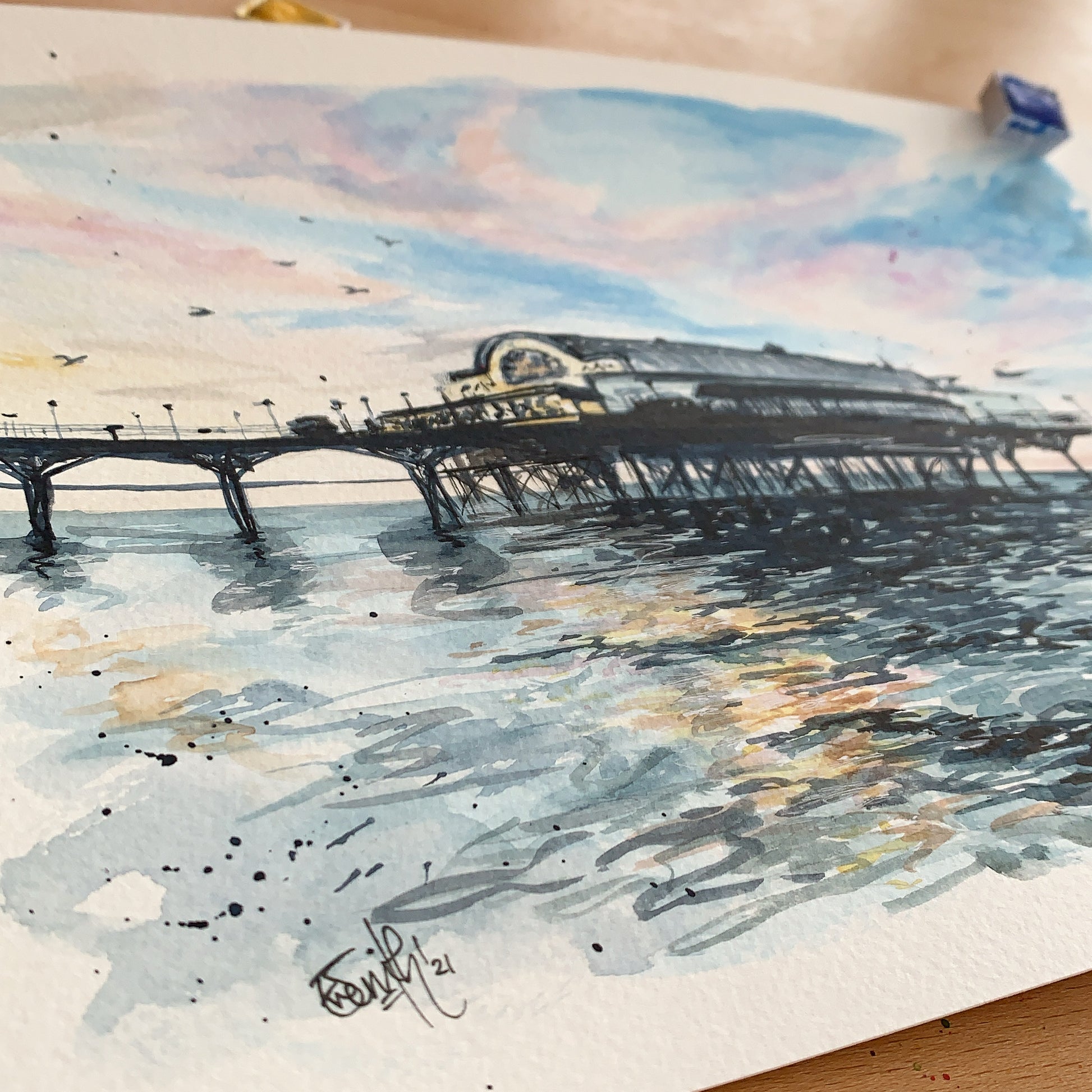 An original watercolour painting of the Cleethorpes Pier at high tide by local Grimsby artist, Eve Leoni Smith. 