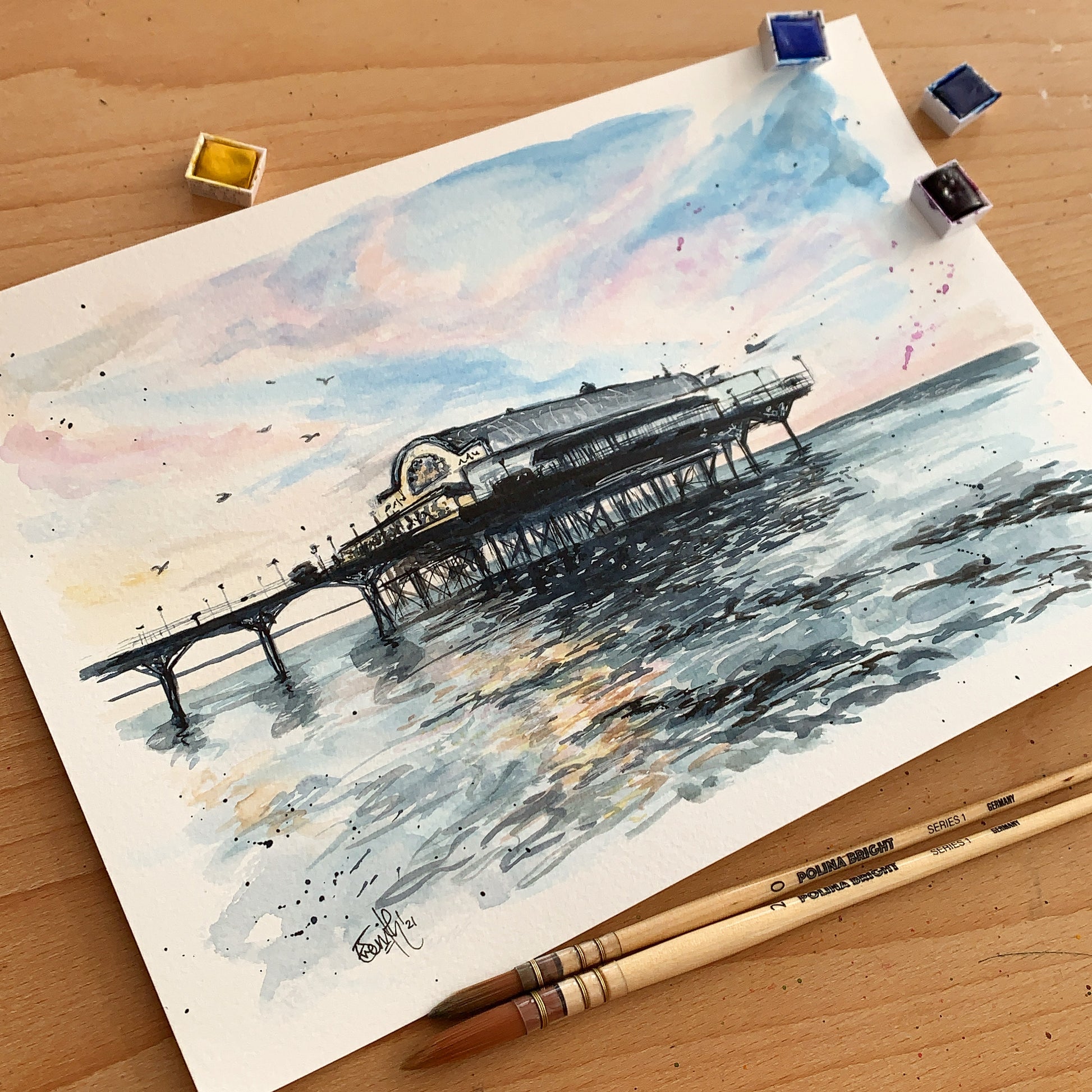 An original watercolour painting of the Cleethorpes Pier at high tide by local Grimsby artist, Eve Leoni Smith. 