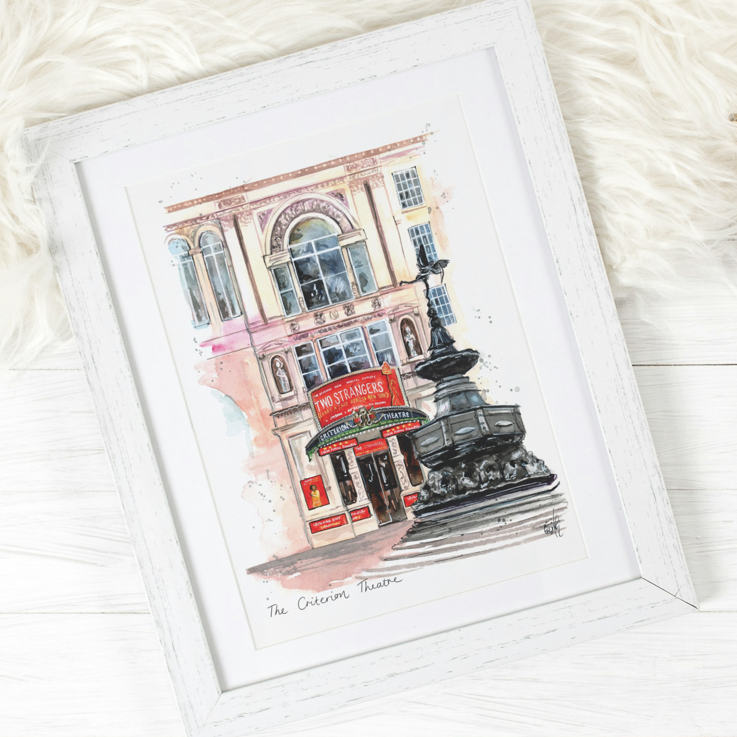 A framed watercolour painting of the Criterion Theatre in Piccadilly Circus, featuring the popular new West End musical, Two Strangers. Painted by local artist and performer, Eve Leoni Smith.