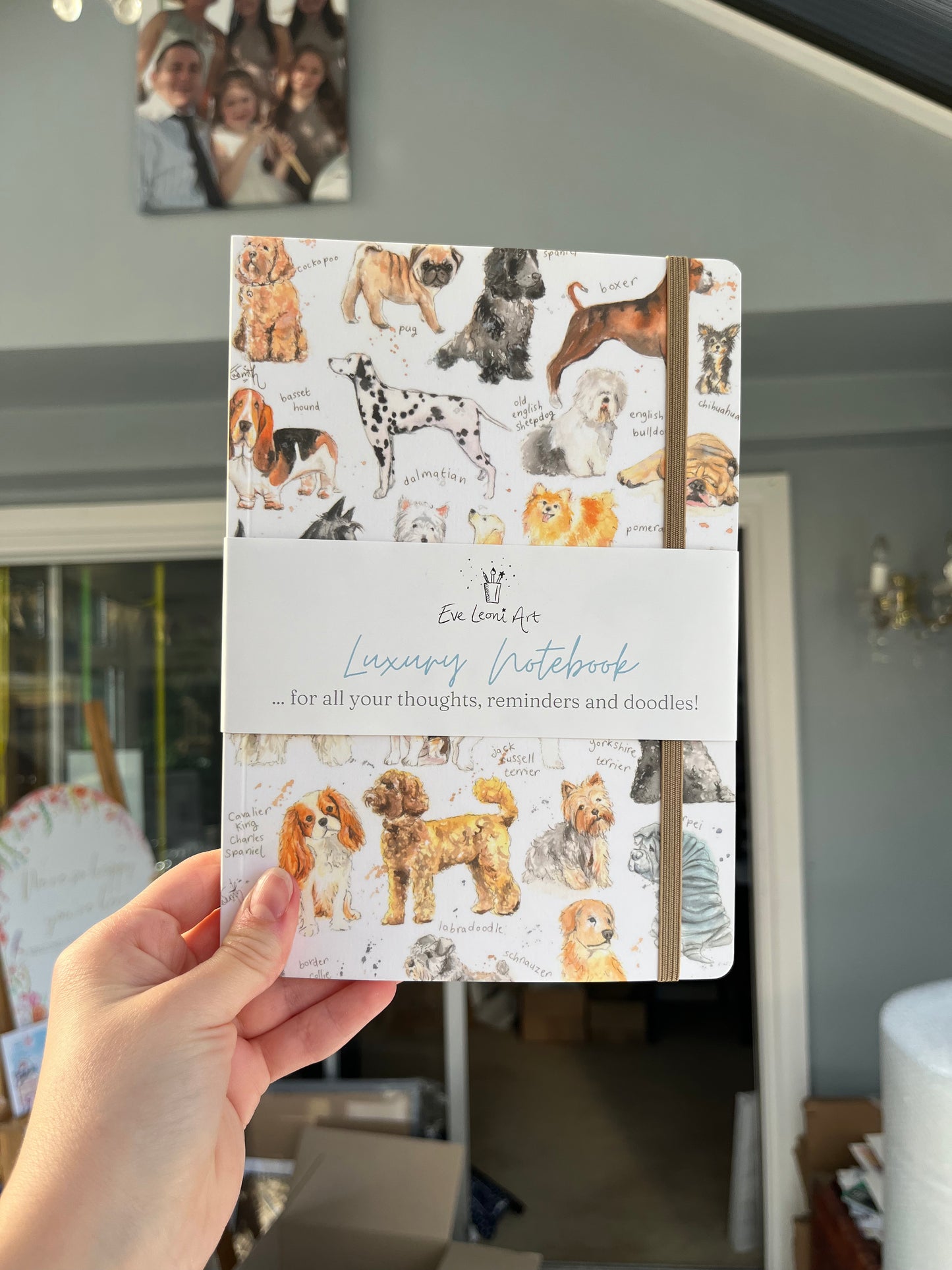 A luxury notebook designed by Lincolnshire based artist, Eve Leoni Smith, featuring watercolour illustrations of different dog breeds.