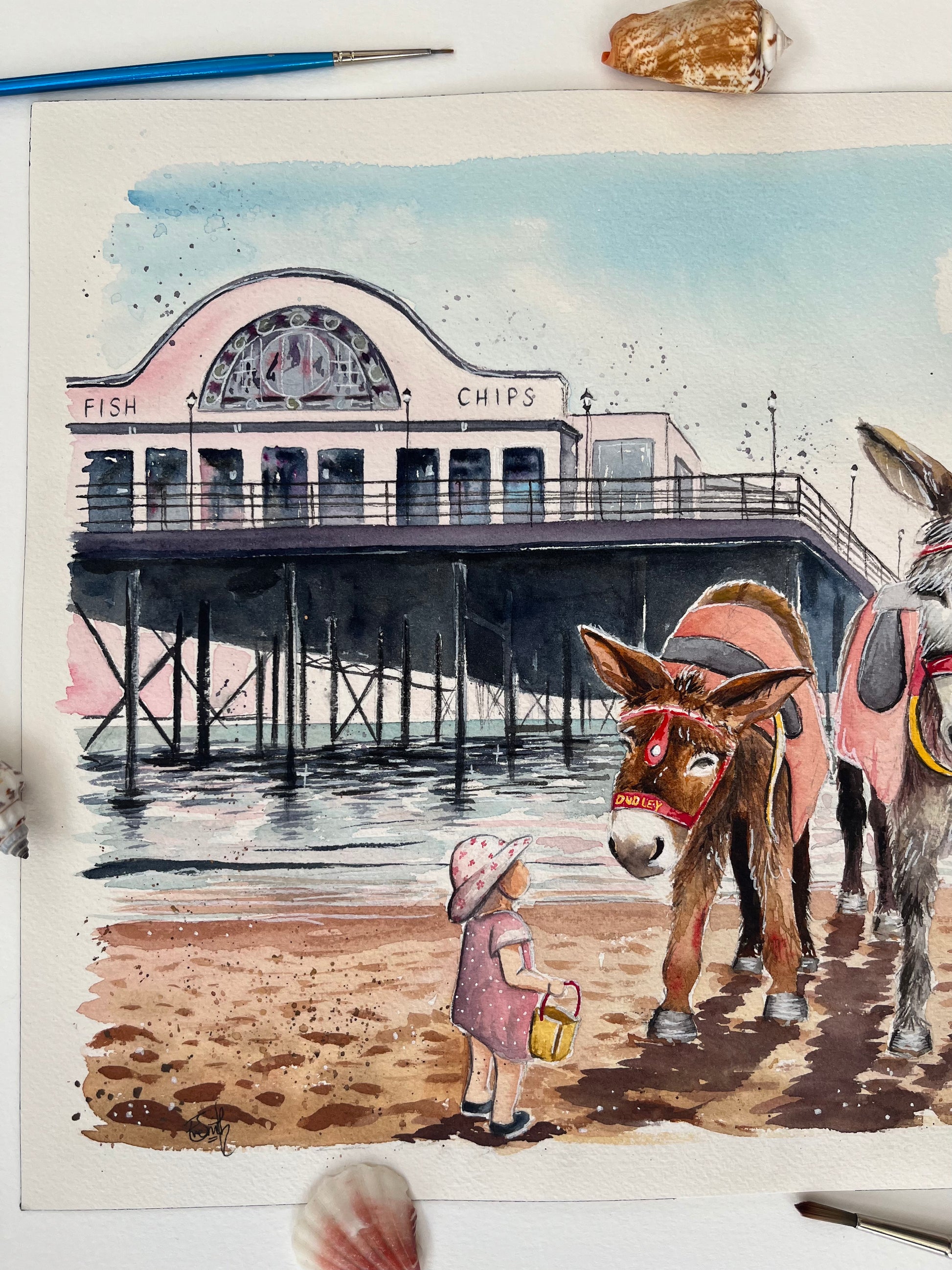 A close-up shot of this eye-catching original painting by Eve Leoni Smith, featuring Dudley the donkey and a young girl in front of Cleethorpes Pier. 