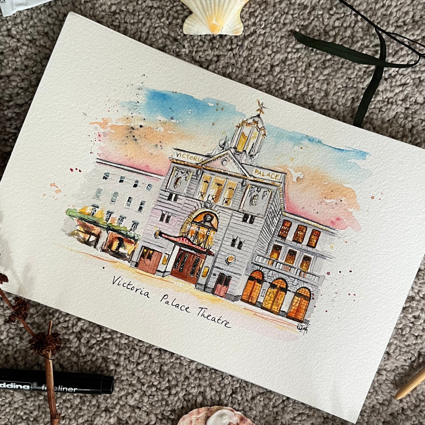 A watercolour painting of the Victoria Palace Theatre in London's West End, painted by local artist and performer, Eve Leoni Smith. 