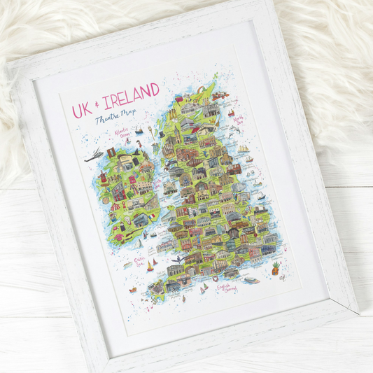 Framed theatre map of UK and Ireland on a white surface, painted by London artist, Eve Leoni Art.