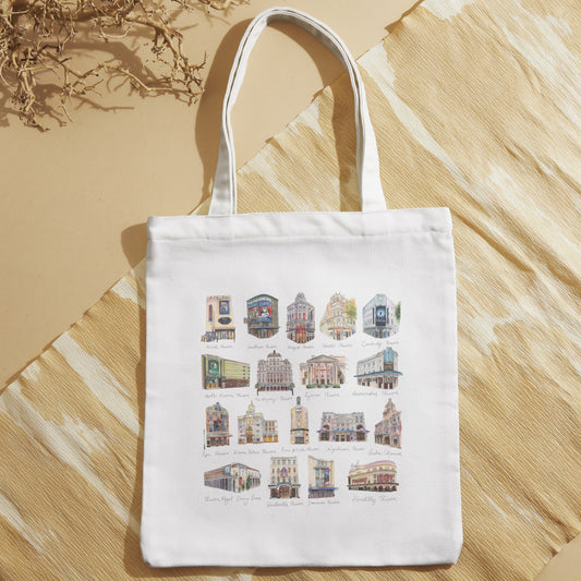 Natural tote bag with colorful West End Theatres by Eve Leoni Art on a beige surface