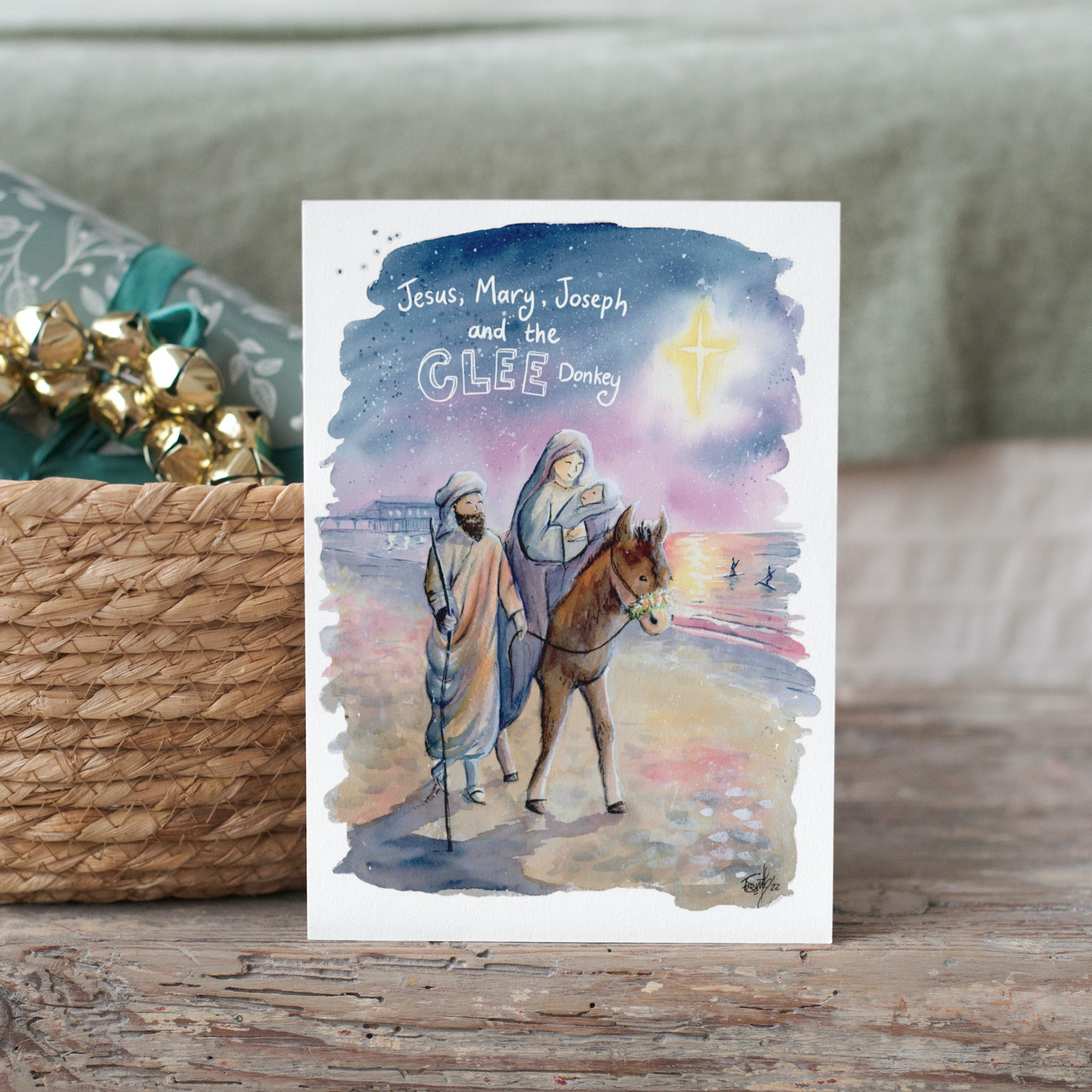 A charming take on the Nativity, local artist Eve Leoni Smith has created a watercolour Christmas Card of Jesus, Mary, Joseph and a Cleethorpes Donkey on Cleethorpes beach.