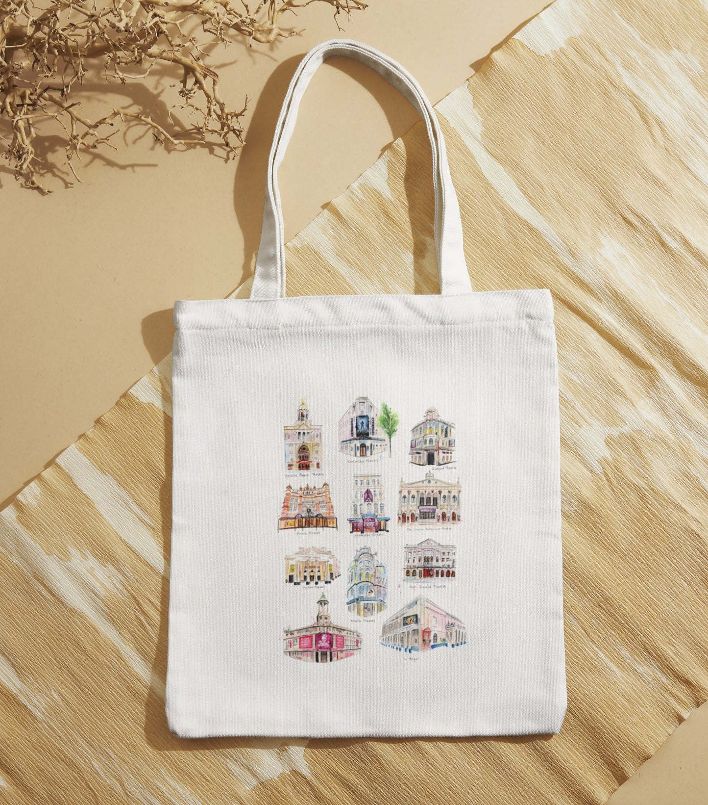 An organic tote bag featuring watercolour illustrations of West End Theatres in London, painted by local artist and performer, Eve Leoni Smith. 